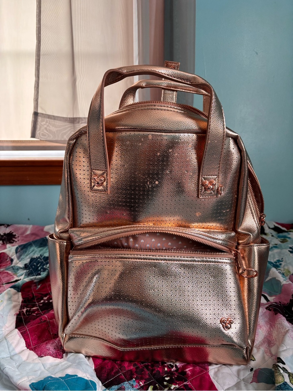 Disney rose gold Pin Displaying back pack